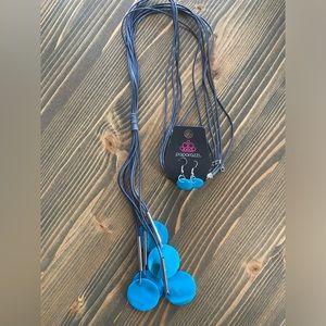 This is a long cord, blue shell, necklace with earrings, lead and nickel free